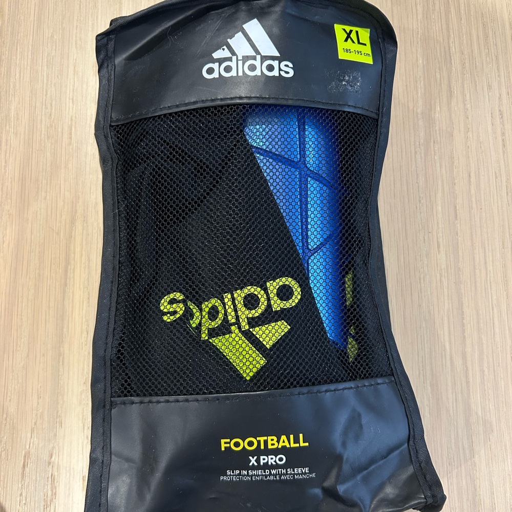 Youth Adidas X Pro Shin Guards in Black and Blue
